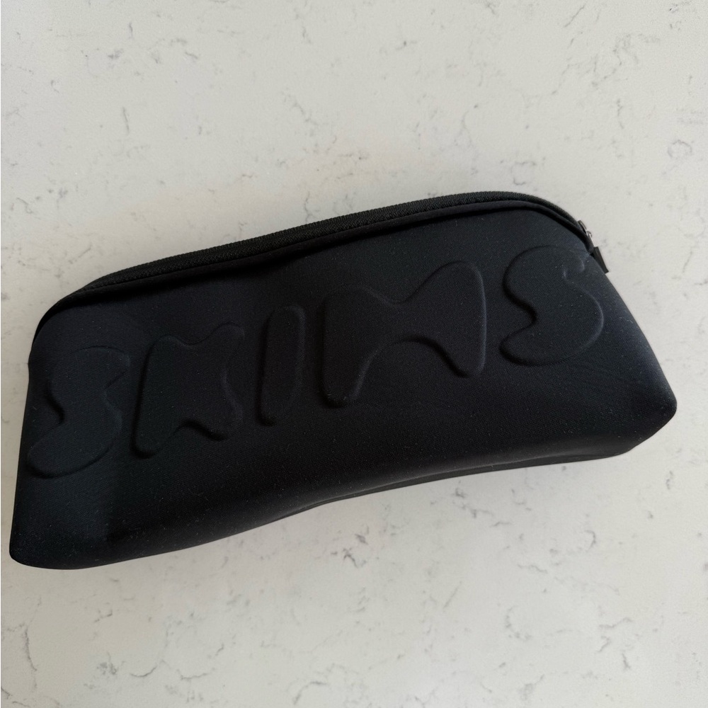 SKIMS Black Pouch